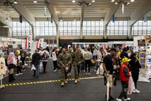 Convention attendees walk the convention floor during Comic Con Okinawa 2024 on Camp Foster, Okinawa, Japan, Dec. 8, 2024. Marine Corps Community Services Okinawa hosted a two-day comic convention, featuring professional cosplayers, artists, and actors as well as food, gaming competitions, a cosplay contest, and multiple vendors.