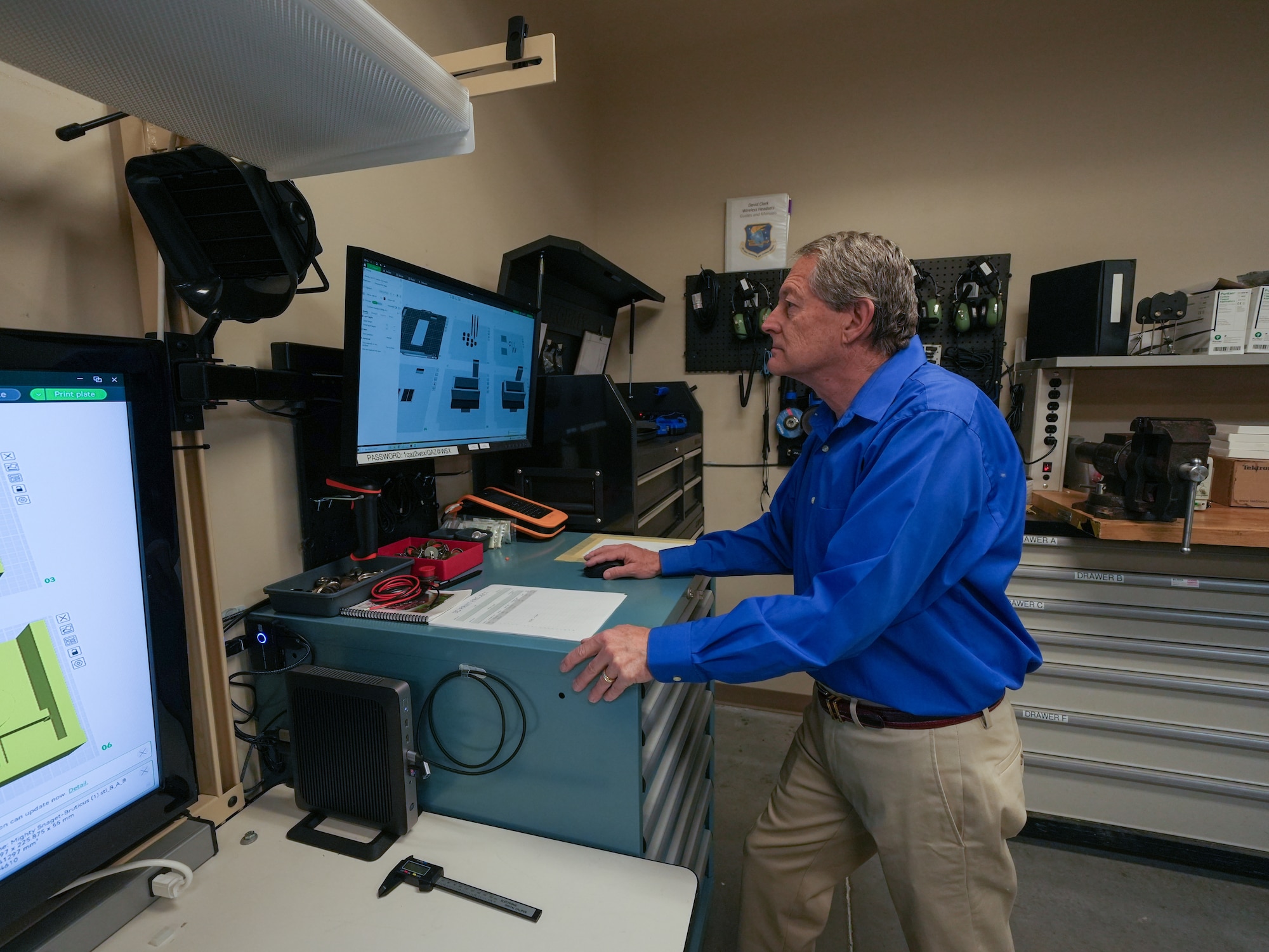 A person works on 3D software on a computer.