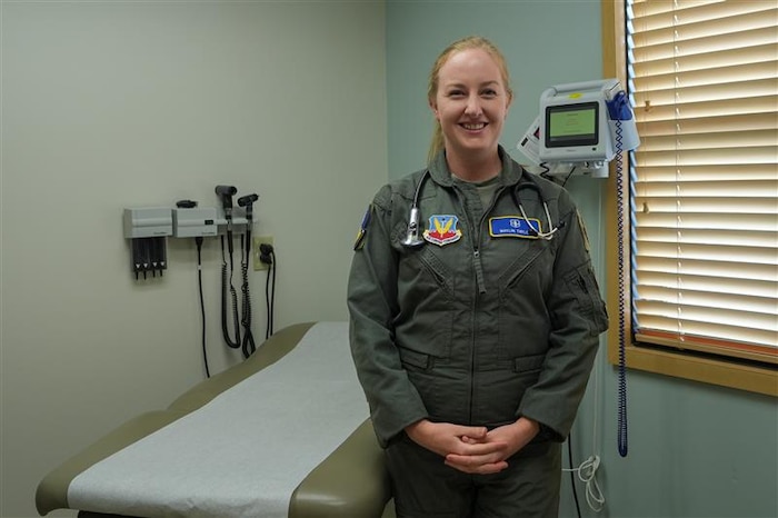 An airman stands for a portrait.