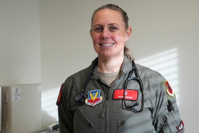 An airman stands for a portrait.