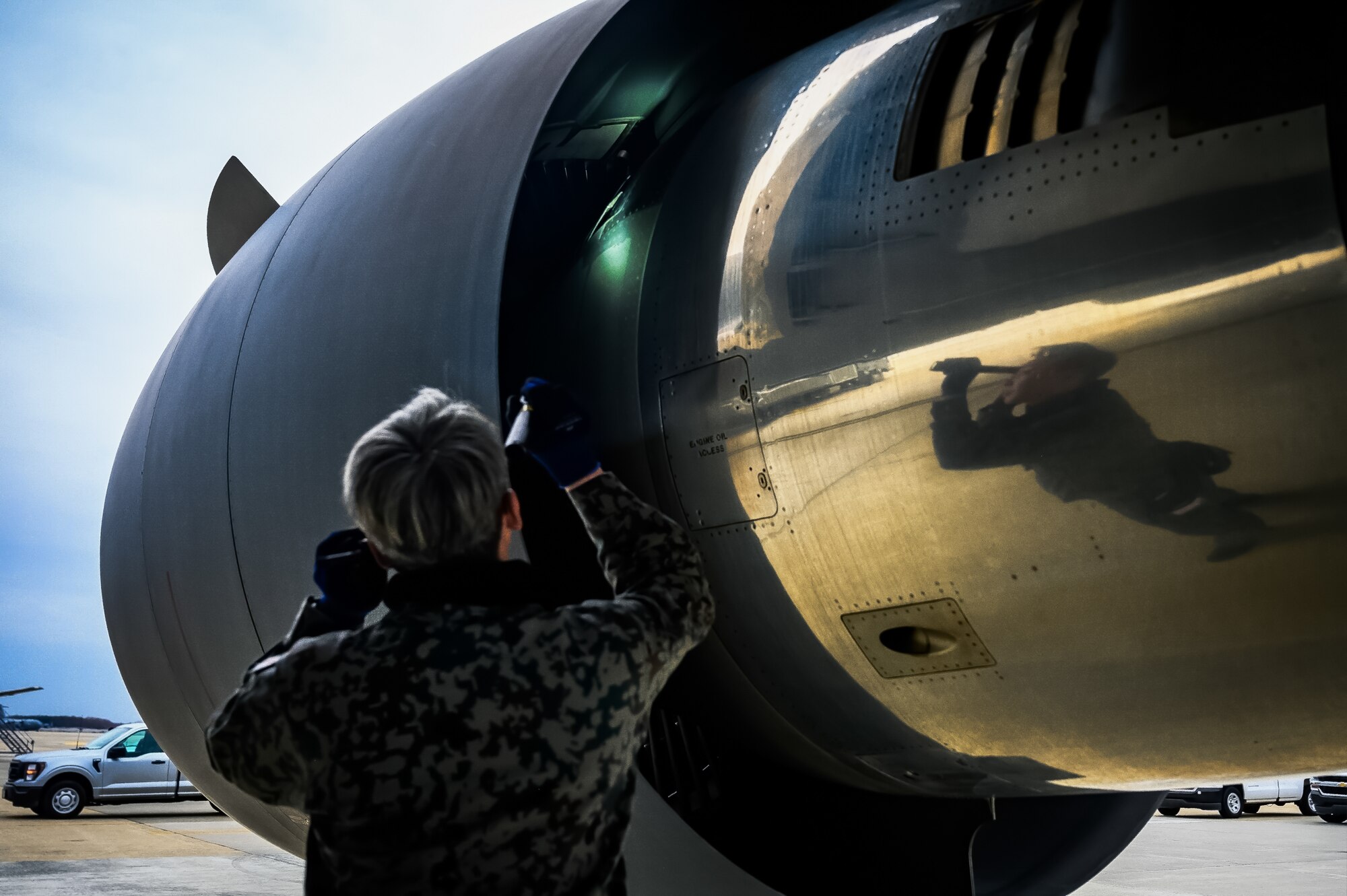 Japan Air Self-Defense Force Senior Airman Yuya Kaneda, 3rd Tactical Airlift Wing aircraft maintainer, performs a maintenance inspection on a KC-46A aircraft at Joint Base McGuire-Dix-Lakehurst, N.J., Dec. 9, 2024. The JASDF visit involved a subject matter expert exchange designed to enhance interoperability with U.S. Air Force KC-46A aircraft units. (U.S. Air Force photo by Senior Airman Matt Porter)
