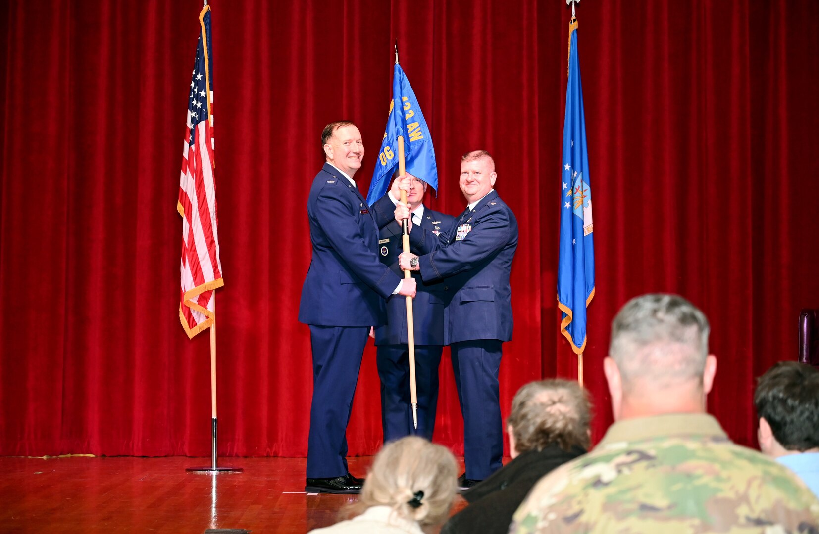 Col. Douglas C. Jeffrey IV, 433rd Airlift Wing commander, presents the guidon to Lt. Col. Jeremy A. Patrick, 433rd Operations Group commander, during the 433rd OG assumption of command ceremony at Joint Base San Antonio-Lackland, Texas, Dec. 7, 2024.