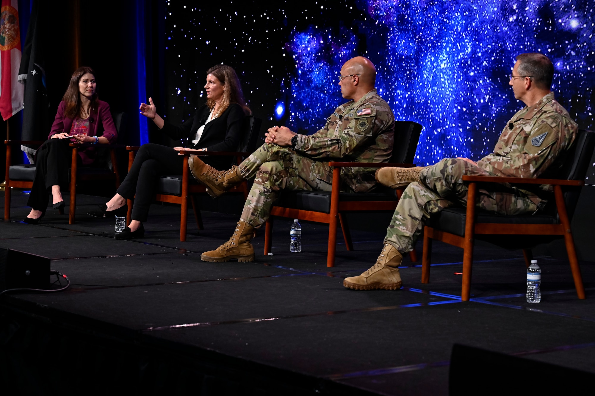 Military members speak on a panel.