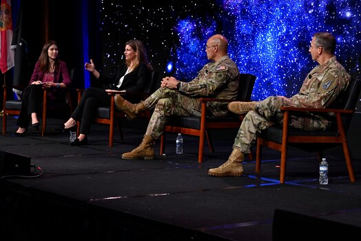  Military members speak on a panel.