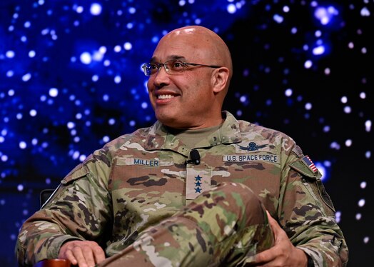  Military member speaks on a panel.