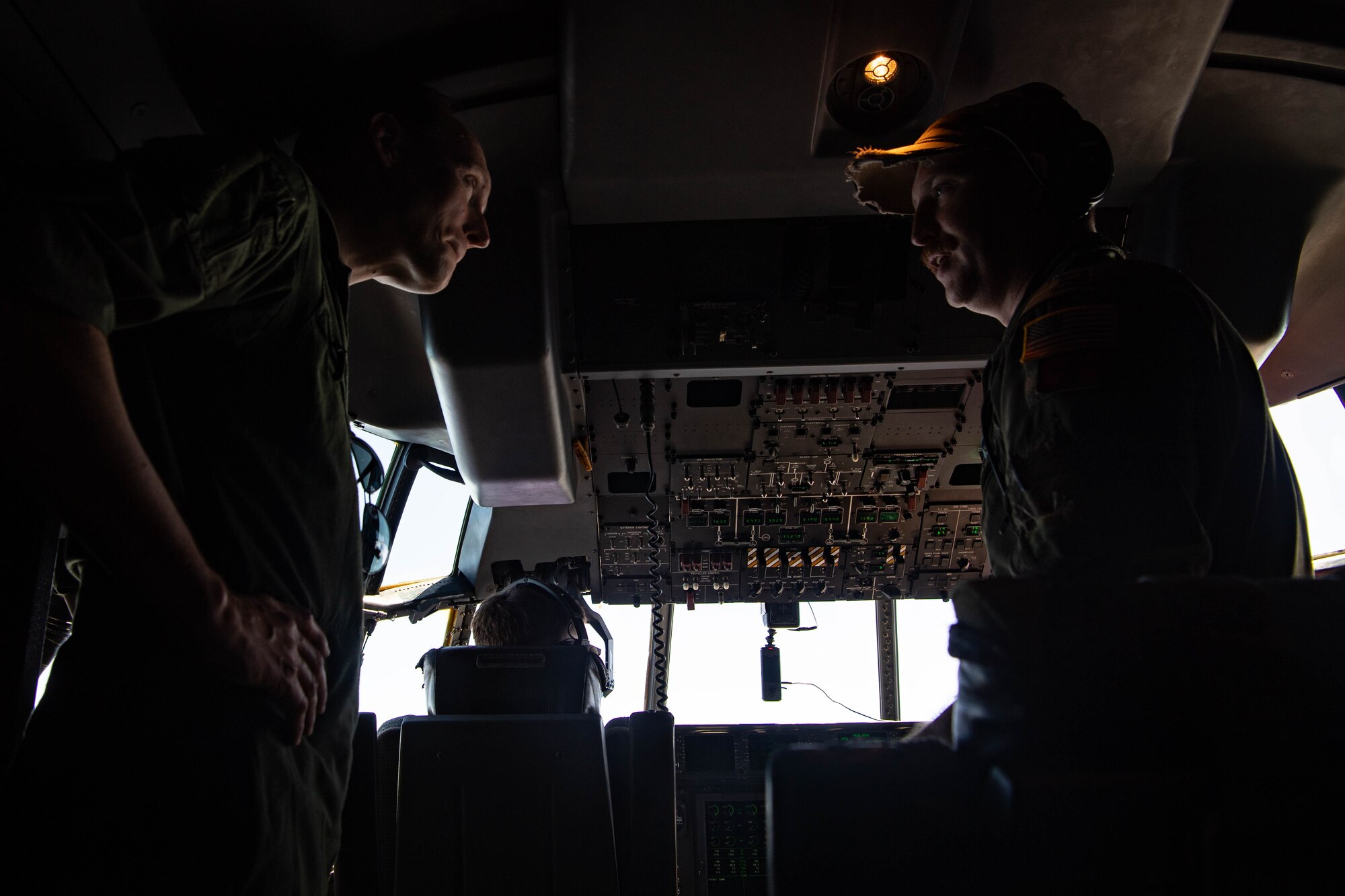 Two men speak with each other.