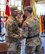 U.S. Army Europe and Africa Lt. Gen. Sean C. Bernabe, Deputy Commanding General (right) passes the unit flag to Col. Tracy Michael, commander, 68th Theater Medical Command (left) during the activation ceremony, Sep. 20, 2024 at Sembach, Germany. The role of the 68th Theater Medical Command is to coordinate, integrate, and synchronize medical support across the Europe and Africa theaters. (U.S. Army Photo by Elisabeth Paqué)