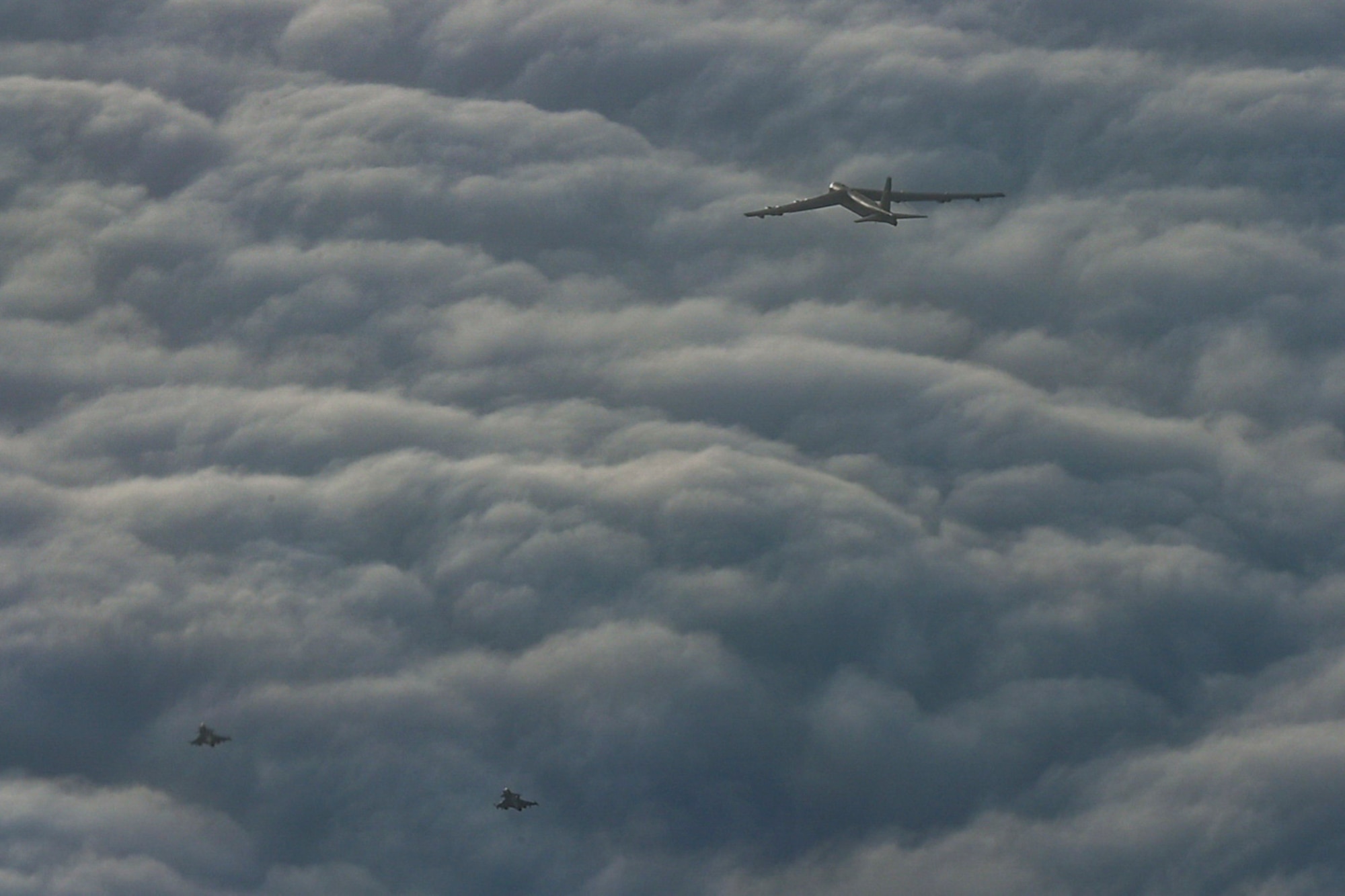 Swedish Air Force Saab JAS 39 Gripens escort a U.S. Air Force B-52H Stratofortress assigned to the 20th Expeditionary Bomb Squadron over Europe during a Bomber Task Force 25-1 mission, Nov. 25, 2024. The U.S. frequently trains alongside NATO Allies to maintain readiness and interoperability in the Baltic Sea region.(U.S. Air Force photo by Staff Sgt. Emily Farnsworth)