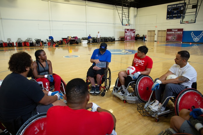 U.S. Marines assigned to Wounded Warrior Regiment study defensive plays for wheelchair rugby during the 2024 Warrior Care Week at Joint Base Andrews, Maryland, Nov. 20, 2024.