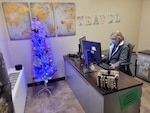 Anita Guevara, Montgomery MEPS transportation assistant, works in new Recruit Travel application. USMEPCOM launched Recruit Travel Application, replacing three outdated systems, on Dec. 12, 2024.