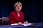 DSCA Director Heidi Grant sits at a table in the Pentagon Press Briefing Room
