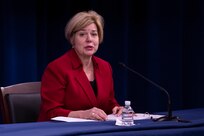 DSCA Director Heidi Grant sits at a table in the Pentagon Press Briefing Room