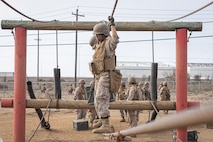 U.S. Marine Corps recruits with Fox Company, 2nd Recruit Training Battalion, navigate an obstacle during the Crucible at Marine Corps Base Camp Pendleton, California, Dec. 3, 2024. The Crucible is a 54-hour exercise where recruits apply the knowledge they learned throughout recruit training to earn the title United States Marine. (U.S. Marine Corps photo by Lance Cpl. Jacob B. Hutchinson)