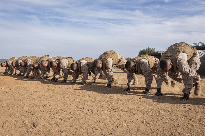 U.S. Marine Corps recruits with Fox Company, 2nd Recruit Training Battalion, conducts mountain climbers a Crucible event at Marine Corps Base Camp Pendleton, California, Dec. 3, 2024. The Crucible is a 54-hour exercise where recruits apply the knowledge they learned throughout recruit training to earn the title United States Marine. (U.S. Marine Corps photo by Lance Cpl. Jacob B. Hutchinson)