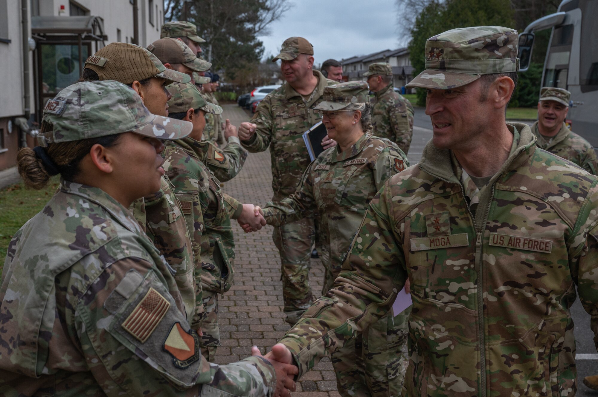 People shake hands in a line