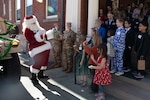 Santa Claus greets families of deployed Colorado National Guard members Dec. 16, 2023, at the Boettcher Mansion in Denver. The annual holiday event hosted by the Governor’s Office and The Adjutant General of Colorado serves as an expression of gratitude to the loved ones of servicemembers who are actively supporting operations overseas throughout the holiday season. (U.S. Air National Guard photo by Senior Airman Melissa Escobar-Pereira)