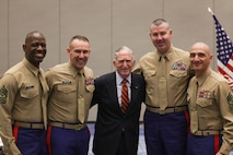 U.S. Marine Corps Gen. Charles Krulak, 31st Commandant of the Marine Corps, retired, center, meets with Marines attending the Fiscal Year 2025 National Officer Selection Officer Training Symposium in Orlando on Dec. 10, 2024. NOSOTS is designed to conduct training, discuss recruiting topics and issues and recognize those Officer Selection Teams which have distinguished themselves during the previous fiscal year. (U.S. Marine Corps photo by Lance Cpl. Brenna Ritchie)