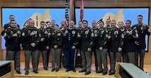 Recruiters pose for a photo in their dress uniforms.