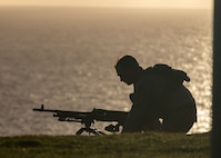 A Pacific Marine sets up an M240B machine gun in preparation for a live-fire range on Marine Corps Base Hawaii, Nov. 27, 2024. The purpose of this exercise was to increase the Marines’ proficiency in different weapons systems and to improve unit readiness for future exercises and operations. (U.S. Marine Corps photo by Lance Cpl. Hailey Riddle-Chan)
