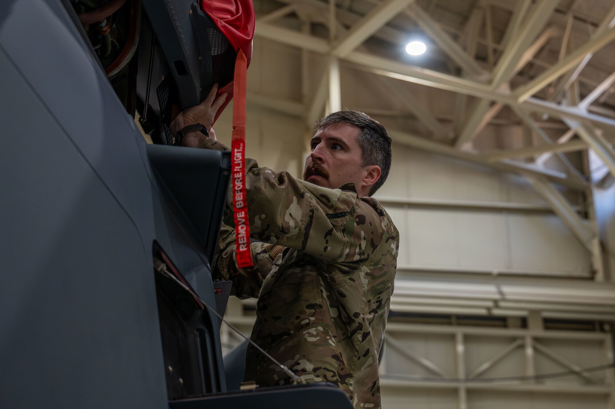 a man checks a helicopter pre-flight