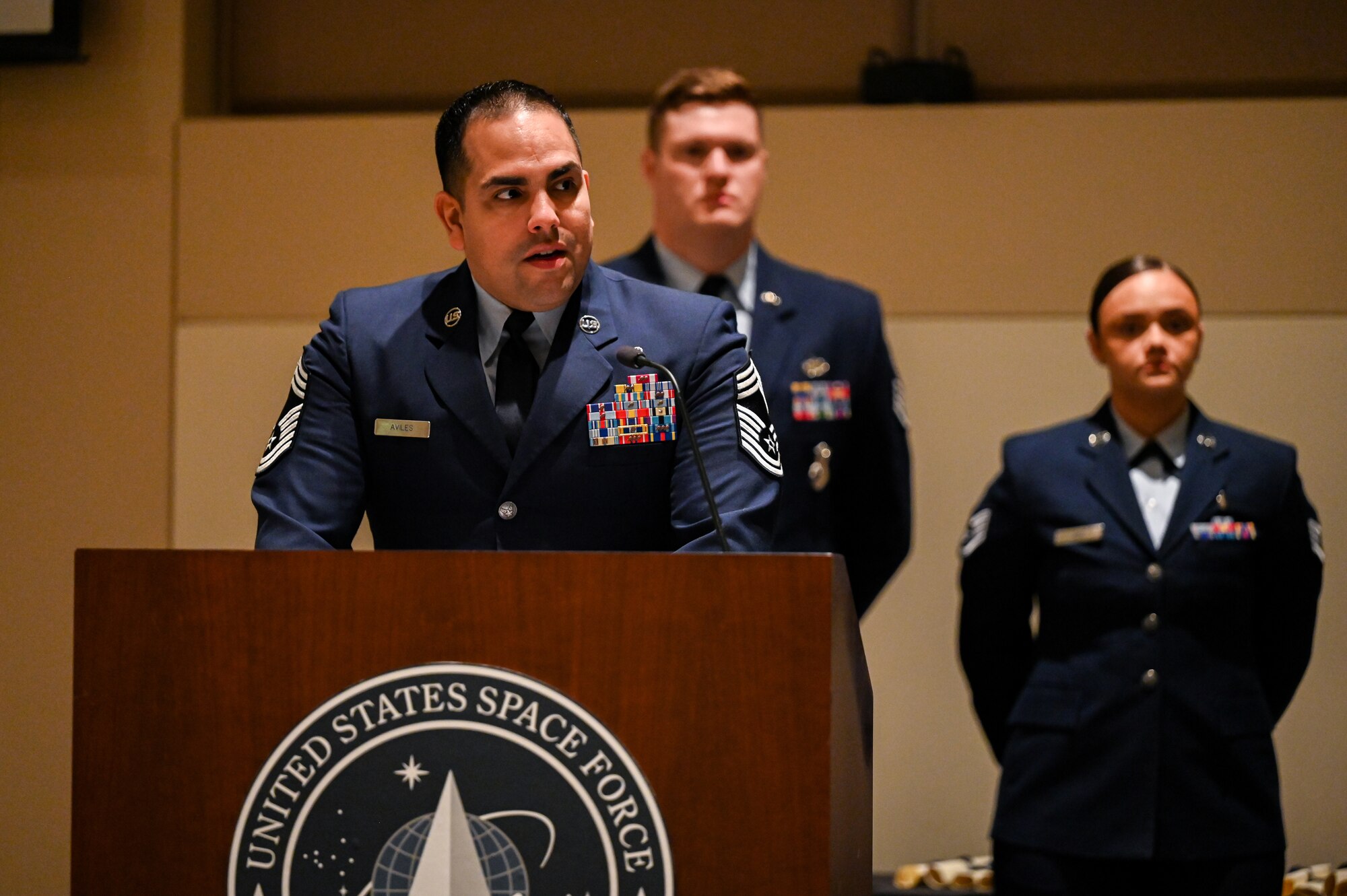 man in air force uniform speaks to audience
