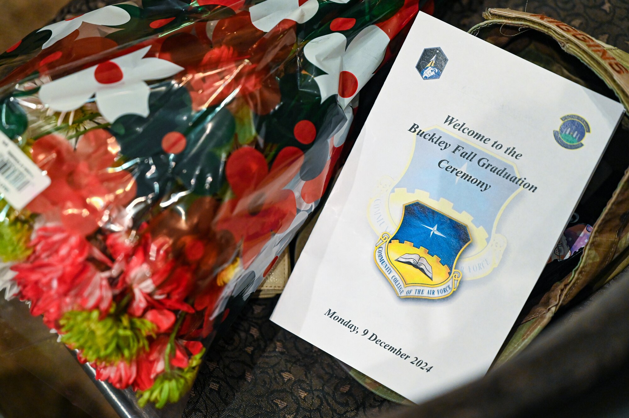 ceremony program sits by flowers