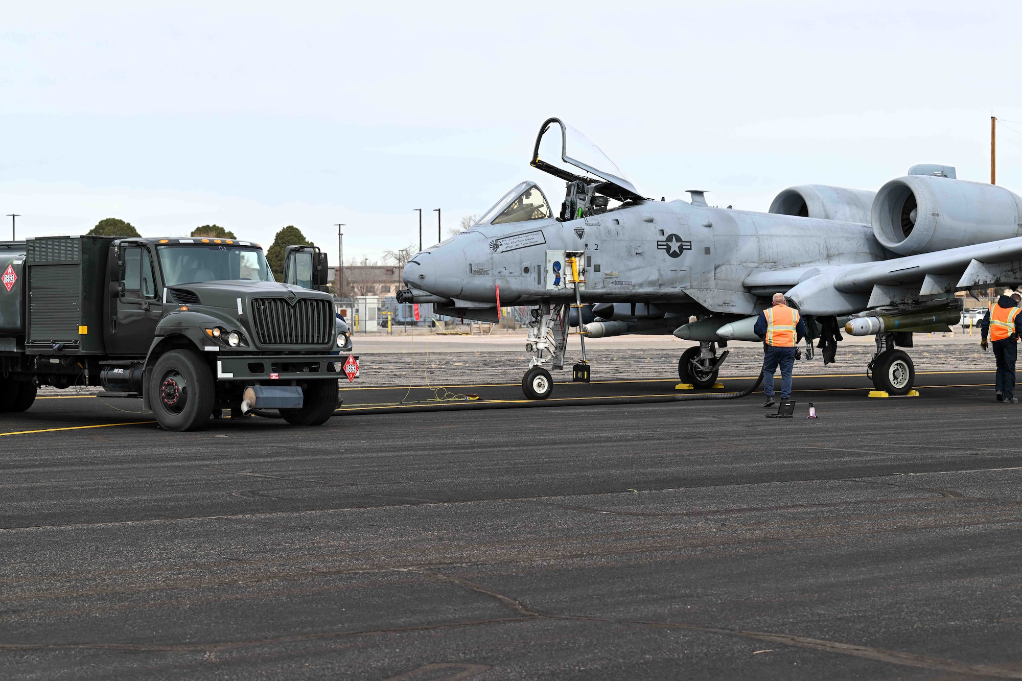 An A-10 Thunderbolt II rests mid-journey for refueling, Dec. 12, on Kirtland Air Force Base, N.M. Kirtland’s Transient Alert and Petroleum Oil and Lubricants team were able to refuel all ten aircraft with-in an hour and a half. (U.S. Air Force Photo by Allen Winston)