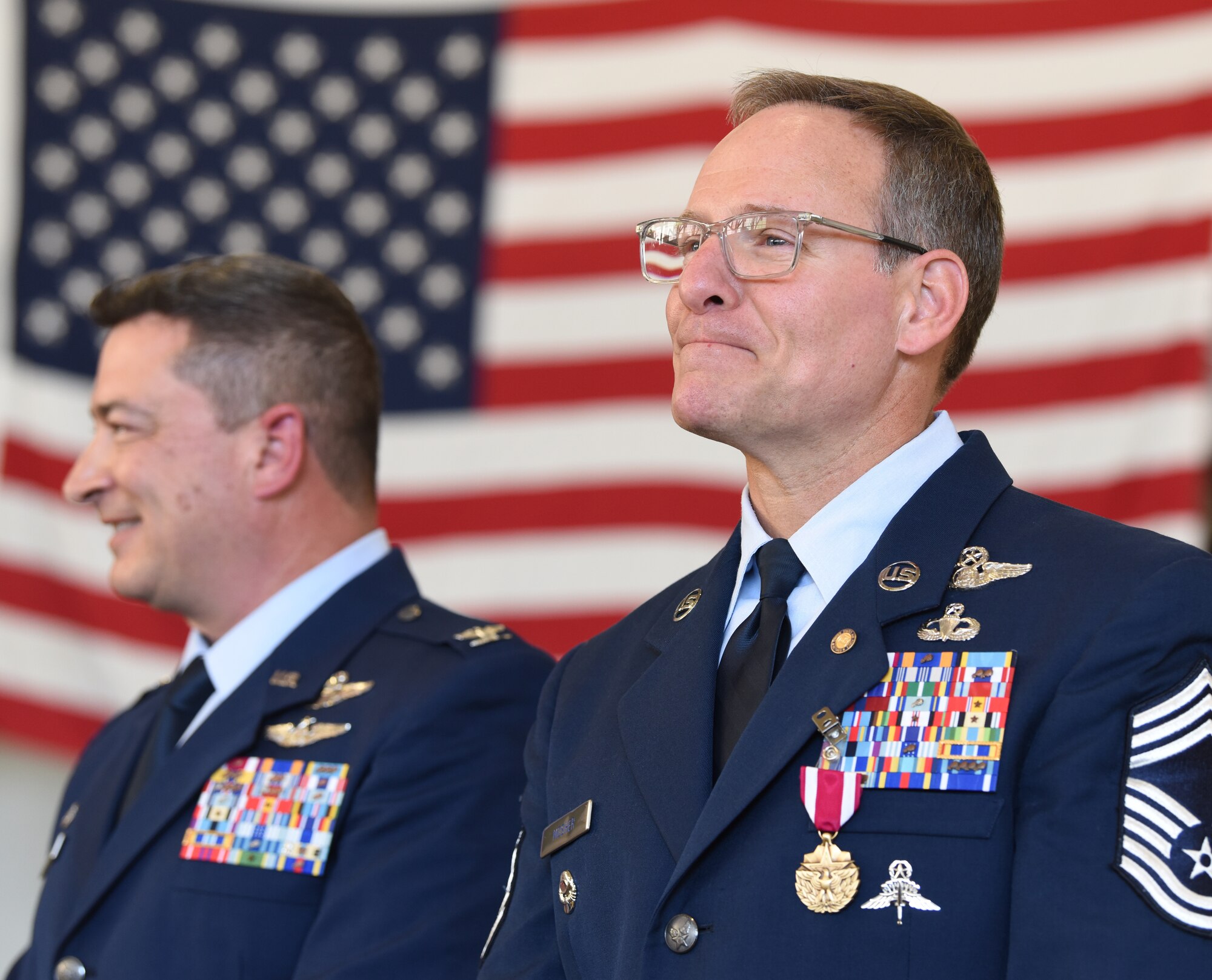 U.S. Air Force Col. Jeffrey Cannet and Chief Master Sgt. Brian Mosher, at Mosher’s retirement ceremony in an aircraft hangar at Francis S. Gabreski Air National Guard Base in Westhampton Beach, New York, Nov. 2, 2024.