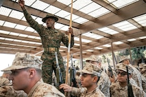 U.S. Marine Corps Drill Instructor, Staff Sgt. Simon Williams Jr., with India Company, 3rd Recruit Training Battalion, instructs recruits during a M16A4 service rifle issue at Marine Corps Recruit Depot San Diego, California, Dec. 9, 2024. Recruits will carry their rifles throughout recruit training and will learn how to properly clean and maintain them to help extend the life of the rifles for future recruits. Marines are warfighters first, and always. Every Marine is a rifleman, and Marine officer is a rifle platoon commander. This unique characteristic distinguishes Marines from all Services, at home and abroad. (U.S. Marine Corps photo by Cpl. Sarah M. Grawcock)