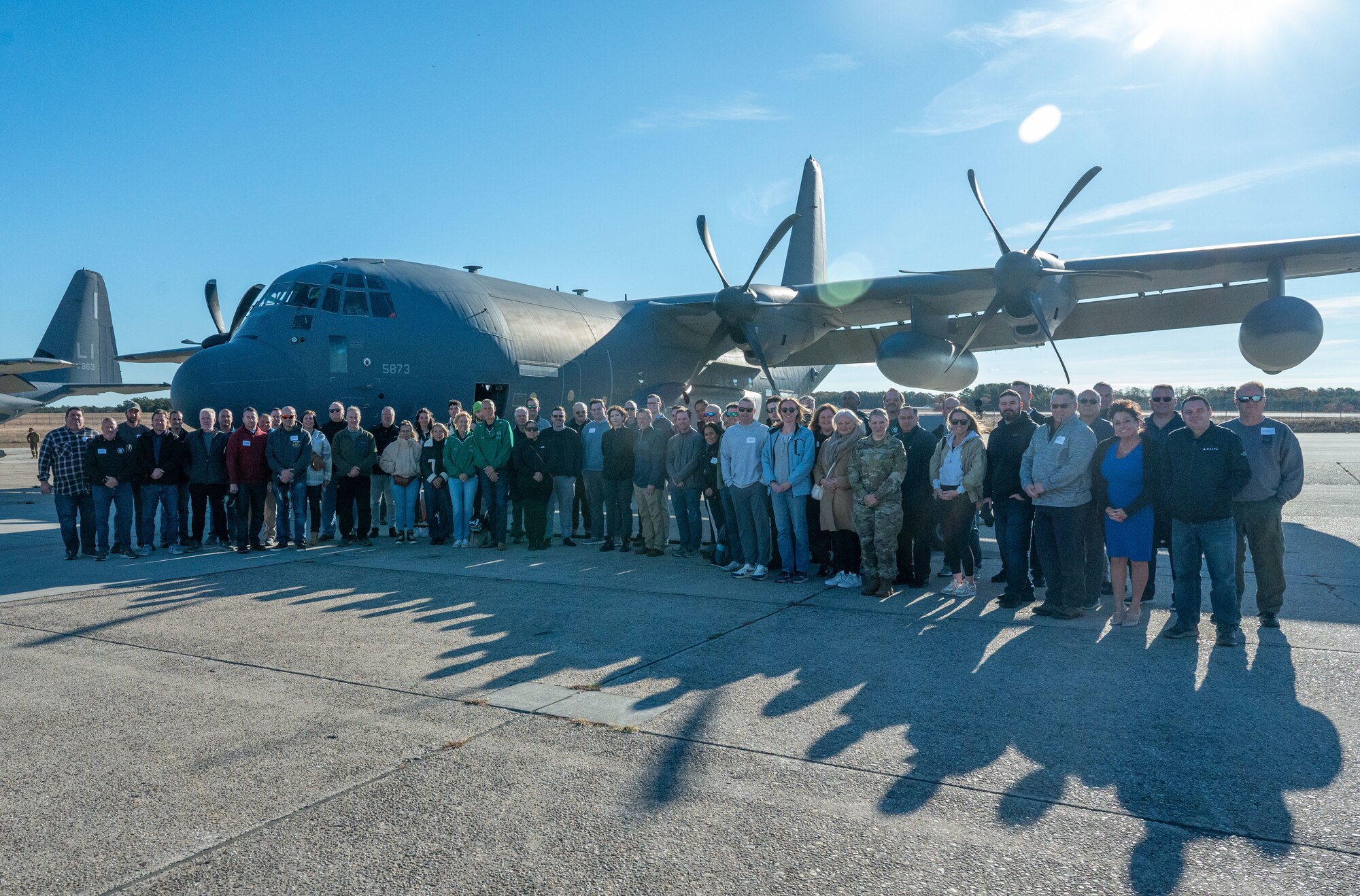 Fifty-eight civilian employers from 28 different companies of New York Air National Guard Airmen from the 106th Rescue Wing stand in front of an HC-130J Combat King II search and rescue aircraft at Francis S. Gabreski Air National Guard Base, Westhampton Beach, N.Y., Nov. 2, 2024.