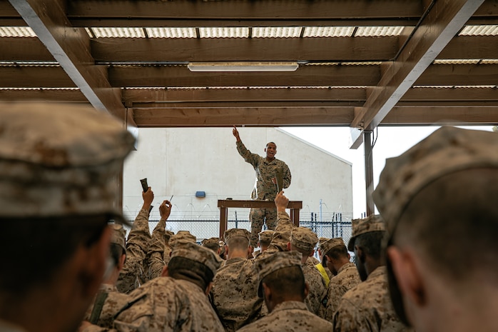 U.S. Marine Corps a Small Arms Repair Technician, Lance Cpl. Maurice Davis, with Headquarters and Service Battalion, Marine Corps Recruit Depot San Diego, instructs recruits with India Company, 3rd Recruit Training Battalion, during a M16A4 service rifle issue at MCRD San Diego, California, Dec. 9, 2024. Recruits will carry their rifles throughout recruit training and will learn how to properly clean and maintain them to help extend the life of the rifles for future recruits. Marines are warfighters first, and always. Every Marine is a rifleman, and Marine officer is a rifle platoon commander. This unique characteristic distinguishes Marines from all Services, at home and abroad. (U.S. Marine Corps photo by Cpl. Sarah M. Grawcock)