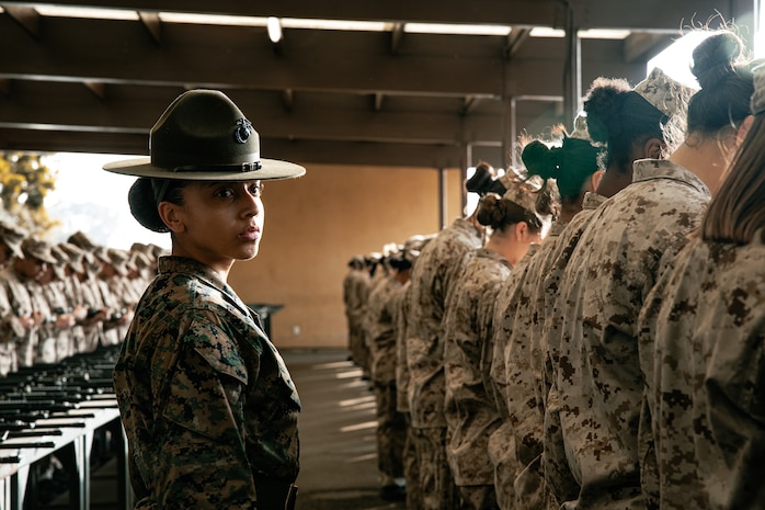 U.S. Marine Corps Drill Instructor, Staff Sgt. Kassandra Luna, with India Company, 3rd Recruit Training Battalion, instructs recruits before for a M16A4 service rifle issue at Marine Corps Recruit Depot San Diego, California, Dec. 9, 2024. Recruits will carry their rifles throughout recruit training and will learn how to properly clean and maintain them to help extend the life of the rifles for future recruits. Marines are warfighters first, and always. Every Marine is a rifleman, and Marine officer is a rifle platoon commander. This unique characteristic distinguishes Marines from all Services, at home and abroad. (U.S. Marine Corps photo by Cpl. Sarah M. Grawcock)