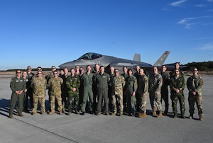 U.S. Air Force Airmen from the New York Air National Guard's 106th Rescue Wing and members of the Swedish Air Force, pose for a group photo in front of an F-35A Lightning II fighter jet assigned to the Vermont Air National Guard’s 158th Fighter Wing, during a Key Leader Engagement, as part of the New York National Guard’s State Partnership Program (SPP), at Francis S. Gabreski Air National Guard Base, Westhampton Beach, N.Y., November 19, 2024