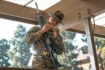U.S. Marine Corps Drill Instructor, Sgt. Fernando Zeballosmanzo, with India Company, 3rd Recruit Training Battalion, instructs recruits on how to properly put a sling on their rifle during a M16A4 service rifle issue at Marine Corps Recruit Depot San Diego, California, Dec. 9, 2024. Recruits will carry their rifles throughout recruit training and will learn how to properly clean and maintain them to help extend the life of the rifles for future recruits. Marines are warfighters first, and always. Every Marine is a rifleman, and Marine officer is a rifle platoon commander. This unique characteristic distinguishes Marines from all Services, at home and abroad. (U.S. Marine Corps photo by Cpl. Sarah M. Grawcock)
