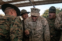 U.S. Marine Corps drill instructors, with India Company, 3rd Recruit Training Battalion, instruct a recruit before for a M16A4 service rifle issue at Marine Corps Recruit Depot San Diego, California, Dec. 9, 2024. Recruits will carry their rifles throughout recruit training and will learn how to properly clean and maintain them to help extend the life of the rifles for future recruits. Marines are warfighters first, and always. Every Marine is a rifleman, and Marine officer is a rifle platoon commander. This unique characteristic distinguishes Marines from all Services, at home and abroad. (U.S. Marine Corps photo by Cpl. Sarah M. Grawcock)