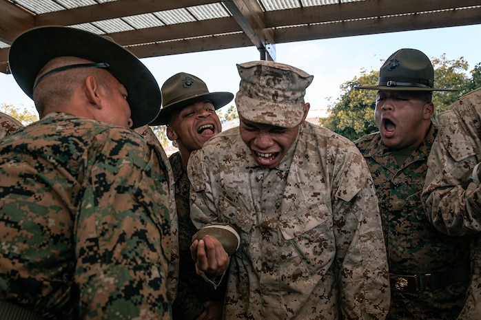 U.S. Marine Corps drill instructors, with India Company, 3rd Recruit Training Battalion, instruct a recruit before for a M16A4 service rifle issue at Marine Corps Recruit Depot San Diego, California, Dec. 9, 2024. Recruits will carry their rifles throughout recruit training and will learn how to properly clean and maintain them to help extend the life of the rifles for future recruits. Marines are warfighters first, and always. Every Marine is a rifleman, and Marine officer is a rifle platoon commander. This unique characteristic distinguishes Marines from all Services, at home and abroad. (U.S. Marine Corps photo by Cpl. Sarah M. Grawcock)