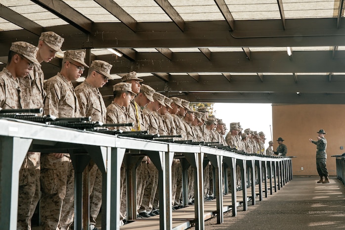 U.S. Marine Corps Drill Instructor, Sgt. Humberto Partida, with India Company, 3rd Recruit Training Battalion, instructs recruits before for a M16A4 service rifle issue at Marine Corps Recruit Depot San Diego, California, Dec. 9, 2024. Recruits will carry their rifles throughout recruit training and will learn how to properly clean and maintain them to help extend the life of the rifles for future recruits. Marines are warfighters first, and always. Every Marine is a rifleman, and Marine officer is a rifle platoon commander. This unique characteristic distinguishes Marines from all Services, at home and abroad. (U.S. Marine Corps photo by Cpl. Sarah M. Grawcock)