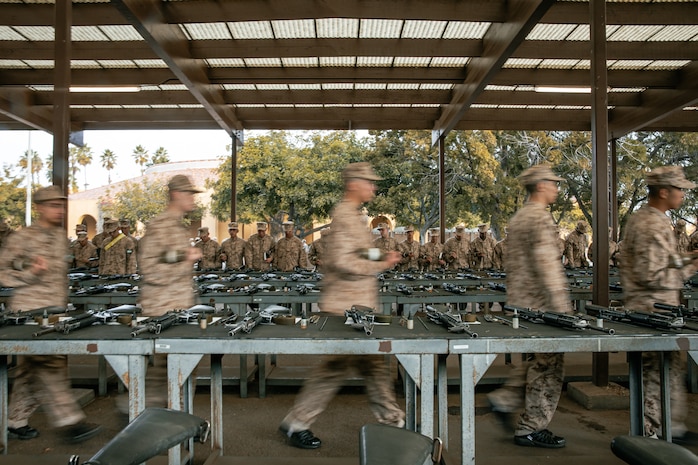 U.S. Marine Corps recruits with India Company, 3rd Recruit Training Battalion, set up for a M16A4 service rifle issue at Marine Corps Recruit Depot San Diego, California, Dec. 9, 2024. Recruits will carry their rifles throughout recruit training and will learn how to properly clean and maintain them to help extend the life of the rifles for future recruits. Marines are warfighters first, and always. Every Marine is a rifleman, and Marine officer is a rifle platoon commander. This unique characteristic distinguishes Marines from all Services, at home and abroad. (U.S. Marine Corps photo by Cpl. Sarah M. Grawcock)