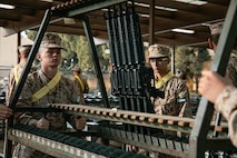 U.S. Marine Corps recruits with India Company, 3rd Recruit Training Battalion, set up rifles for a M16A4 service rifle issue at Marine Corps Recruit Depot San Diego, California, Dec. 9, 2024. Recruits will carry their rifles throughout recruit training and will learn how to properly clean and maintain them to help extend the life of the rifles for future recruits. Marines are warfighters first, and always. Every Marine is a rifleman, and Marine officer is a rifle platoon commander. This unique characteristic distinguishes Marines from all Services, at home and abroad. (U.S. Marine Corps photo by Cpl. Sarah M. Grawcock)