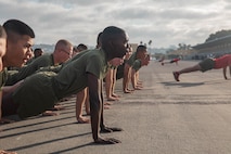 New U.S. Marines with Charlie Company, 1st Recruit Training Battalion, conduct dynamic warm-ups prior to the company motivational run at Marine Corps Recruit Depot San Diego, California, Dec. 12, 2024. The company motivational run is a three-mile cadence run conducted around the Depot, the last physical training event the Marines will conduct before they graduate from MCRD San Diego and the first time their friends and families will see their newly transformed U.S. Marines. (U.S. Marine Corps photo by Cpl. Alexandra M. Earl)