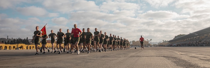 U.S. Marines with Charlie Company, 1st Recruit Training Battalion, participate in the company motivational run at Marine Corps Recruit Depot San Diego, California, Dec. 12, 2024. The company motivational run is a three-mile cadence run conducted around the Depot, the last physical training event the Marines will conduct before they graduate from MCRD San Diego and the first time their friends and families will see their newly transformed U.S. Marines. (U.S. Marine Corps photo by Cpl. Alexandra M. Earl)