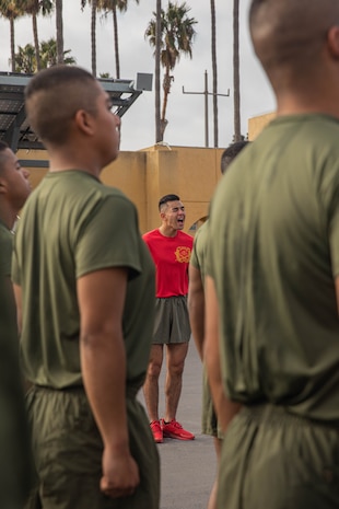 U.S. Marine Corps Drill Instructor Sgt. Shuri Manning, with Charlie Company, 1st Recruit Training Battalion, gives a command to the new Marines after the company motivational run at Marine Corps Recruit Depot San Diego, California, Dec. 12, 2024. The company motivational run is a three-mile cadence run conducted around the Depot, the last physical training event the Marines will conduct before they graduate from MCRD San Diego and the first time their friends and families will see their newly transformed U.S. Marines. (U.S. Marine Corps photo by Cpl. Alexandra M. Earl)