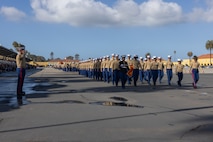 U.S. Marines with Charlie Company, 1st Recruit Training Battalion, march in formation during a graduation ceremony at Marine Corps Recruit Depot San Diego, California, Dec. 13, 2024. Graduation took place at the completion of the 13-week transformation, which included training for drill, marksmanship, basic combat skills, and Marine Corps customs and traditions. (U.S. Marine Corps photo by Lance Cpl. Jacob B. Hutchinson)