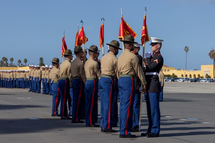 U.S. Marine Corps drill instructors with Charlie Company, 1st Recruit Training Battalion, prepare to retire the guidons as a part of a graduation ceremony at Marine Corps Recruit Depot San Diego, California, Dec. 13, 2024. Graduation took place at the completion of the 13-week transformation, which included training for drill, marksmanship, basic combat skills, and Marine Corps customs and traditions. (U.S. Marine Corps photo by Lance Cpl. Jacob B. Hutchinson)