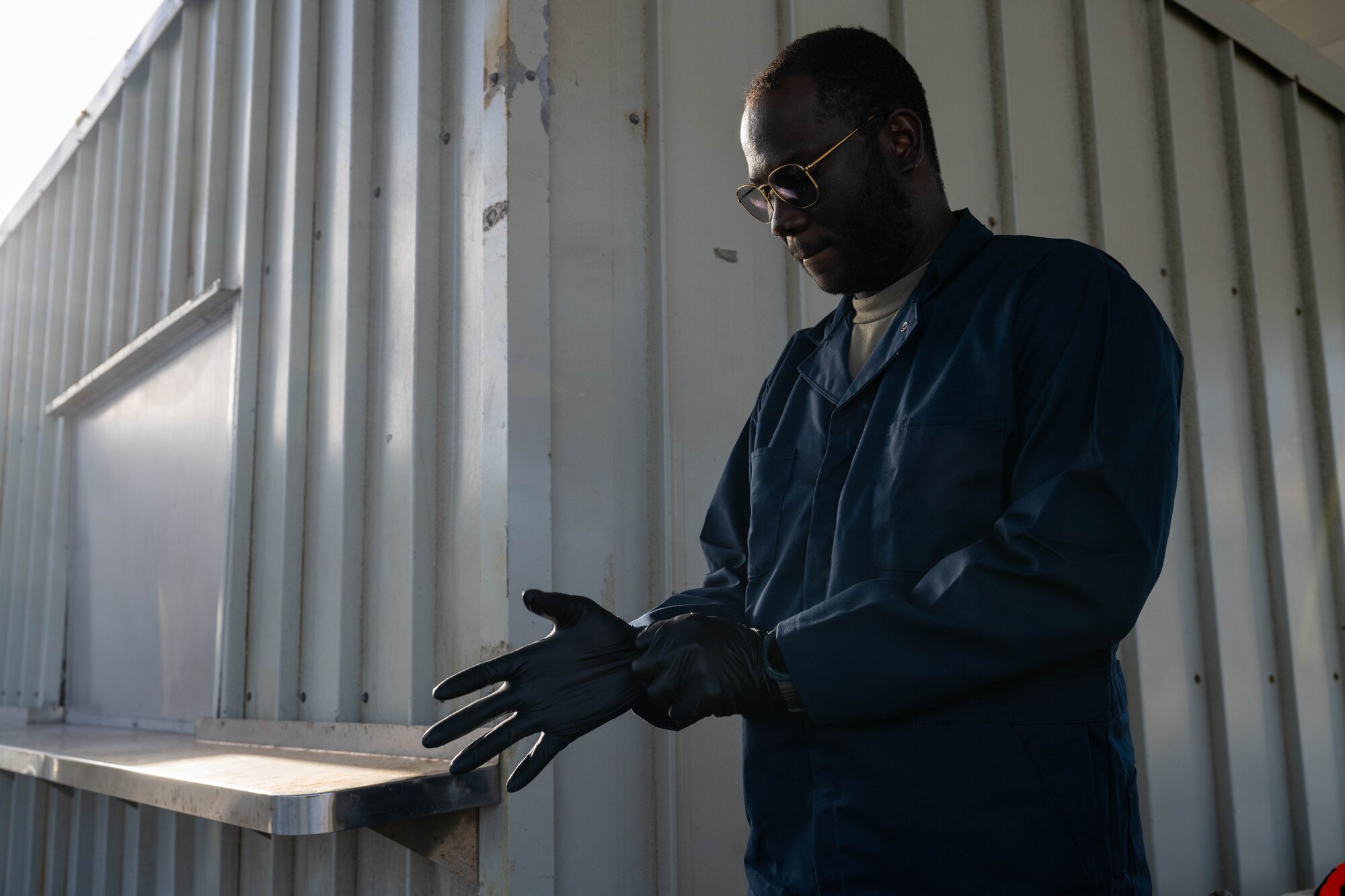 U.S. Air Force Airmen gears up in his pest management gear to survey a barge docked on Joint Base Pearl Harbor-Hickam, Hawaii for potential pests.