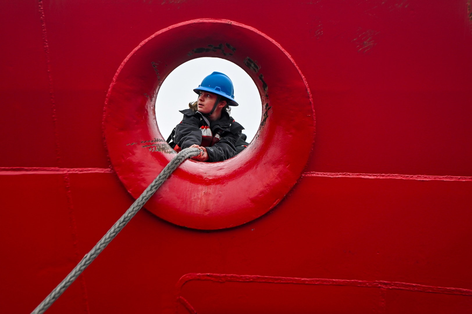 A member of the Coast Guard Cutter Healy (WAGB 20) handles mooring lines near the bow. CGC Healy returned from a multi-month deployment involving contributions to Arctic Oceanographic Research, mapping previously uncharted waters, and supporting early career scientists in polar research. (U.S. Coast Guard photo by Petty Officer 3rd Class Annika Hirschler)