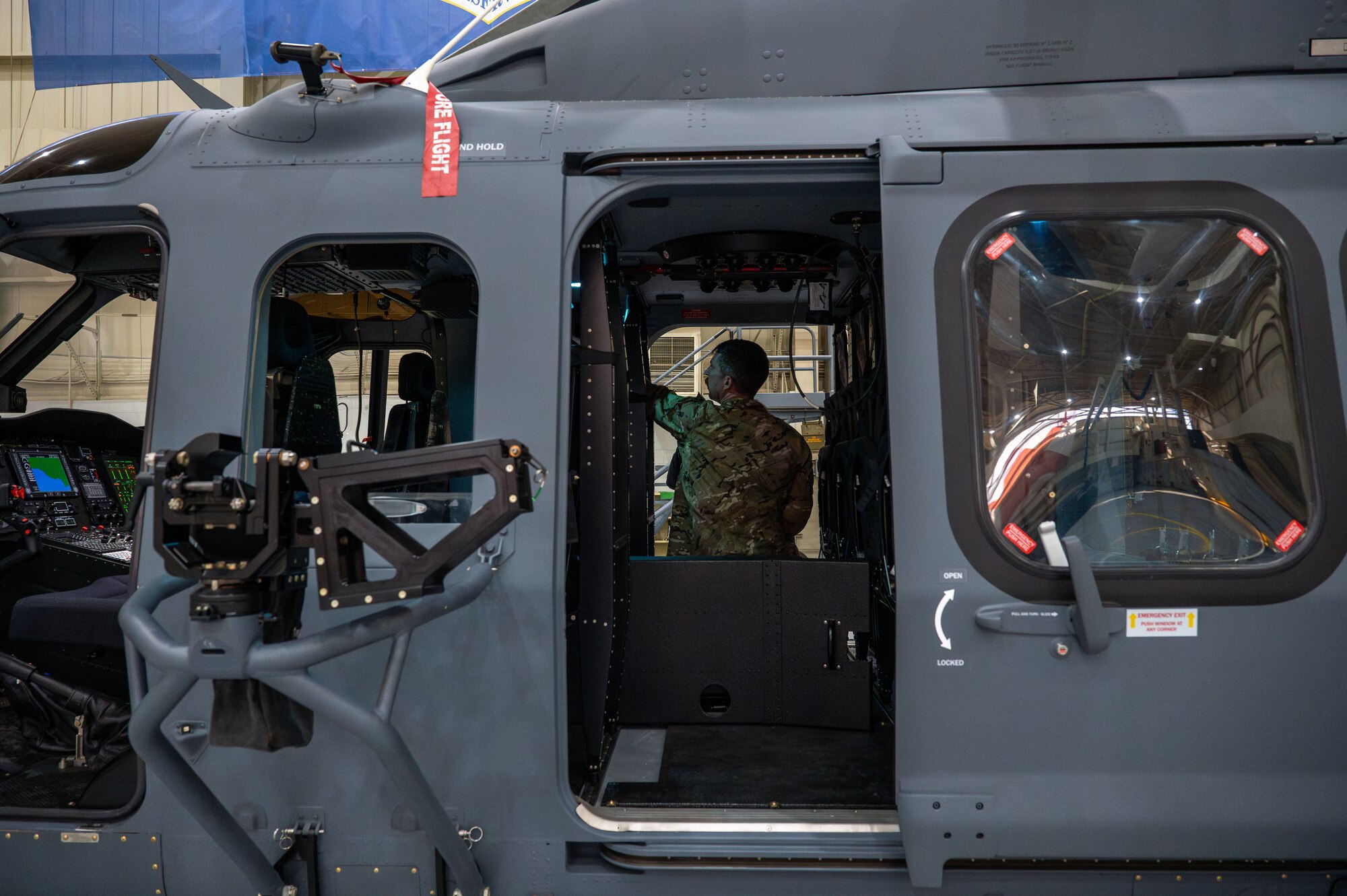 U.S. Air Force Tech. Sgt. Joshua Coward, 703rd Helicopter Squadron special mission aviator, sits inside of an Integrated Aircrew Systems Trainer during a training session at Maxwell Air Force Base, Alabama on Dec. 11, 2024.