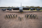 Operations Airmen from the 20th Expeditionary Bomb Squadron stand together in front of a B-52H Stratofortress during Bomber Task Force 25-1 Dec. 4, 2024, at RAF Fairford, England. BTF missions familiarize aircrew with air bases and operations in different geographic combatant command areas of operations to enable strategic access and integration with coalition forces in an effort to deter global conflict. (U.S. Air Force photo by Senior Airman Mary Bowers)