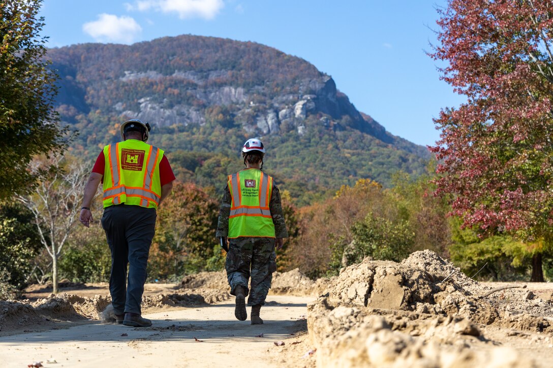 Two men walking in nature.