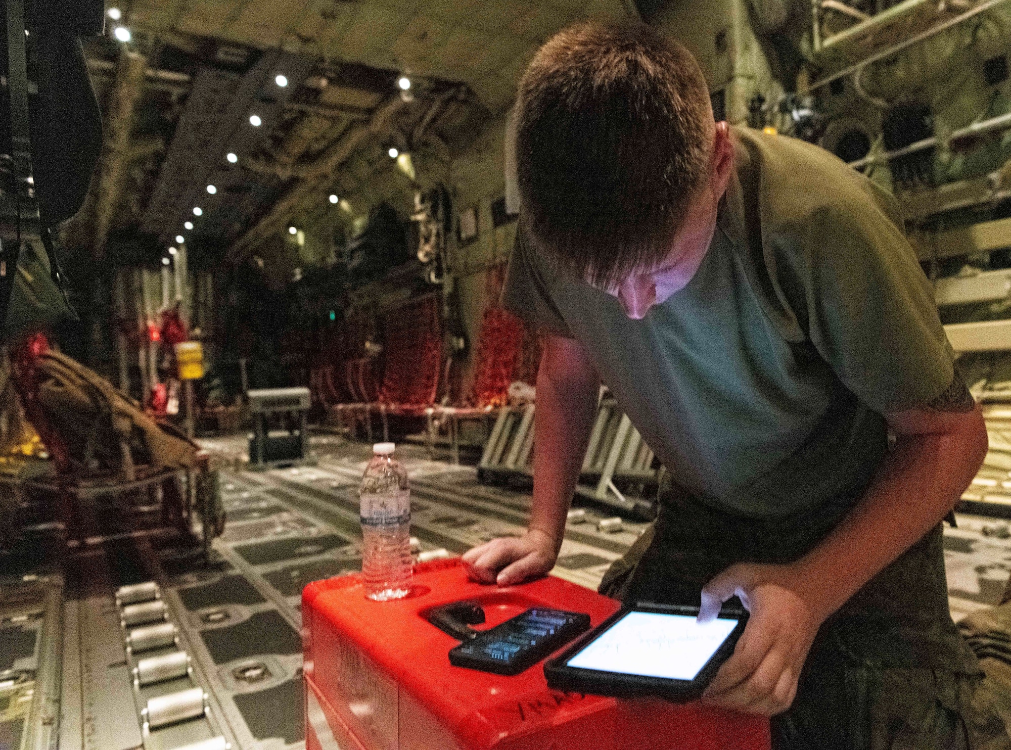 U.S. Air Force and Royal Australian Air Force maintainers perform nighttime maintenance on a C-130J Super Hercules during Operation Christmas Drop 2024 at Andersen Air Force Base, Guam. The maintainers worked around the clock to ensure aircraft were mission-ready for humanitarian airdrop operations delivering essential supplies to remote Pacific island communities.